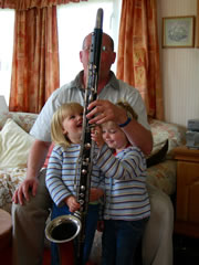 [Image: Andy playing the contra with his daughters]